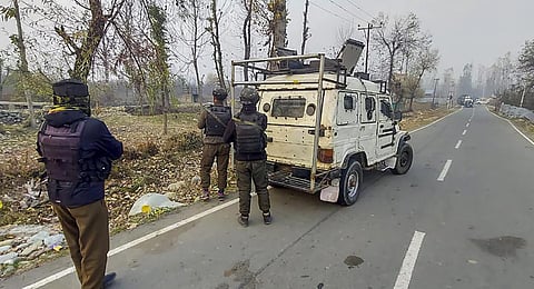 Security personnel stand guard during an encounter with militants. (Photo | PTI)
