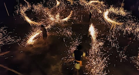The village of Poorikudisai in the Villupuram-Tiruvannamalai region engaged in celebrating Karthigai Deepam in an eco-friendly manner, using lamps made of palm fronds, called Maavoli. (Photo | Special