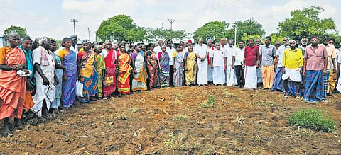 Beneficiaries in Dharapuram gather at a farmland that was retrieved after 20 years, along with Tiruppur Lok Sabha MP K Subbarayan | S Senbagapandiyan