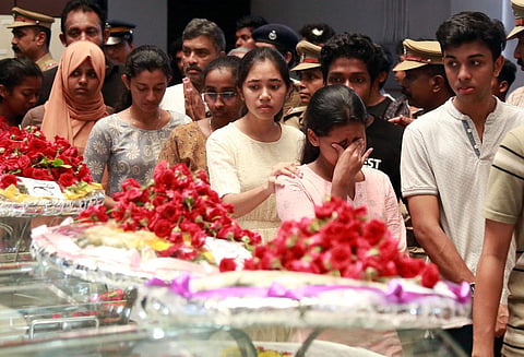 Students break down when the bodies of the three students were brought to the School of Engineering building at Cusat for people to pay homage on Sunday. (Photo | T P Sooraj)