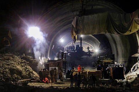 Rescue officials at the entrance of Silkyara Tunnel during the operation to rescue 41 workers trapped inside (Photo | PTI)