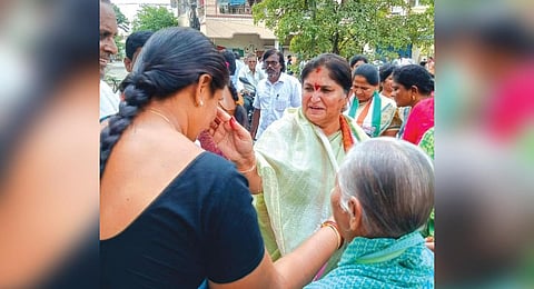Mallu Nandini meets voters in Madhira constituency during a campaign