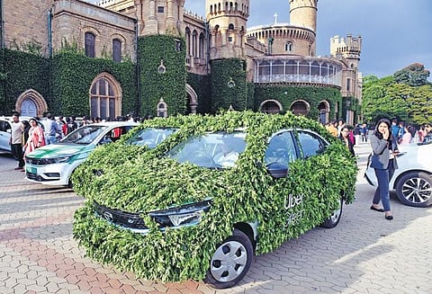Uber cars promoting sustainability on display at the Bengaluru Tech Summit 2023, on Thursday | Vinod Kumar.T