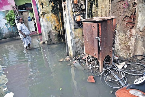 Electric cables loosely connected to a ‘power box’ at Venkatammal Samadi Street at Purasaivakkam, posing a threat to the residents during rainy days. (Photo |  P Jawahar)