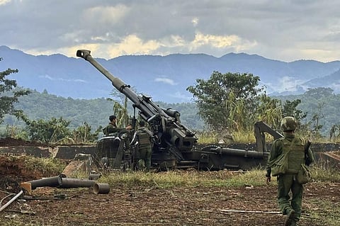 Members of a rebel group check weapons allegedly seized from a Myanmar army outpost (File Photo | AP)