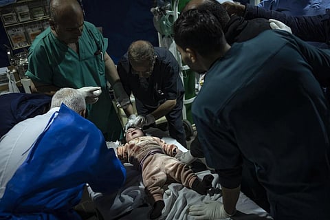 A Palestinian girl wounded in the Israeli bombardment of the Gaza Strip arrives at a hospital in Rafah on Wednesday, Dec 13, 2023. (Photo | AP)
