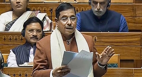 Parliamentary Affairs Minister Pralhad Joshi speaks in the Lok Sabha during the Winter session of Parliament, in New Delhi, Thursday, Dec. 14, 2023. (PTI Photo)