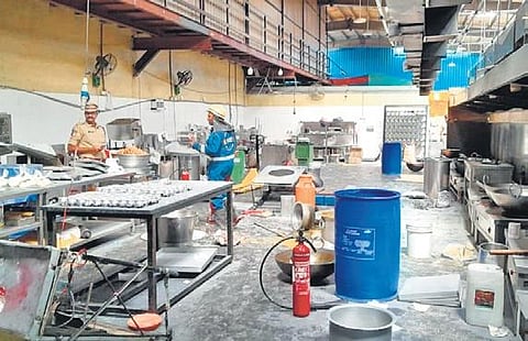 Police  along with rescue  team at the Karachi Bakery unit at Gaganpahad, the blast site, after a LPG cylinder exploded there on Thursday