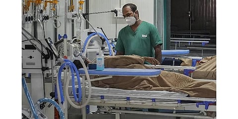 male nurse attends a covid-19 patient inside an ICU at Rajiv Gandhi Institute of Chest Disease in Bengaluru,Tuesday, Dec 19, 2023.  (Photo | PTI)