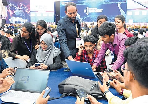 Students busy completing their task  at the Bengaluru Tech Summit venue o the third day of the summit.