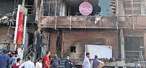 A fire force personnel suffered minor injuries while putting off the fire in the three-storeyed building in Marathahalli on Monday night  | Allen Egenuse J