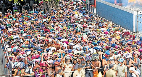Heavy rush at lower thirumuttam. As many as 65,000 pilgrims visited the hill shrine till 3 pm on Tuesday  | Express