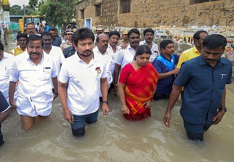 Tamil Nadu Minister for Youth Affairs and Sports Development Udhayanidhi Stalin with others visits a flood-affected area, in Thoothukudi district.