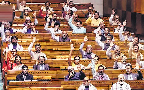 Prime Minister Narendra Modi and other members in the Lok Sabha on Thursday | pti