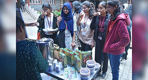 Students try out ragi malt at the ‘Millets In My Plate’ event at Mount Carmel College  ahead of an international conference on millets, in Bengaluru on Thursday | Express