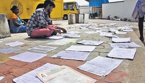 Documents reclaimed from houses being dried in the sun at Vadakku Authoor. (Photo | V Karthikalagu, EPS)