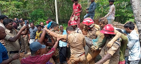 Vinayan, a native of Ayirooppara near Pothencode  and Deepak, a native of Bihar were the two worker who were rescued after being tarpped under soil. (Photo | PTI)