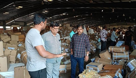 Joint Secretary Kumar Duraisamy inspecting the garments destroyed by flooding in a warehouse of Container Freight Station near Tuticorin port | Express