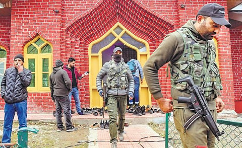 Security personnel gather at the mosque where the retired senior superintendent of police was killed in Baramulla on Sunday | ANI