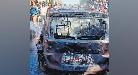 The charred remains of the MUV which caught fire in Anchepalya on Bengaluru- Tumakuru road, in Bengaluru on Tuesday. (Photo | Express)