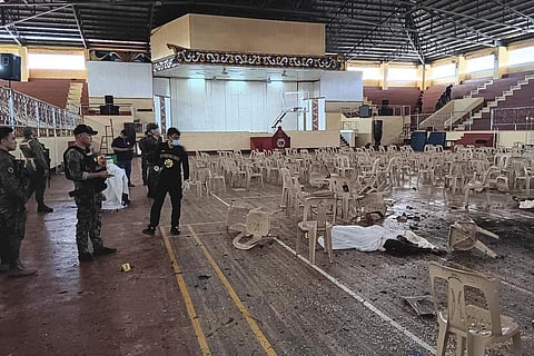 In this handout  provided by the Provincial Government of Lanao Del Sur - Public Information Office, law enforcers conduct an investigation at the explosion site in Marawi city | AP