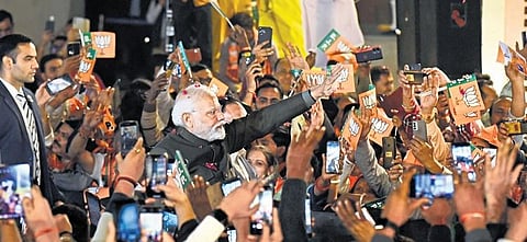 PM Narendra Modi being greeted by supporters as he arrives to attend the BJP’s victory celebrations in New Delhi on Sunday | parveen negi