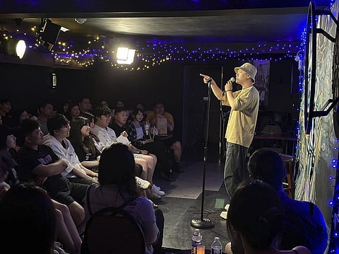Comedian Lin Dongxiao, who uses the stage name Guazi, Lin performs standup in Toronto, Saturday, June 10, 2023. Lin moved back to China to pursue a career in standup comedy.  (Photo | AP)