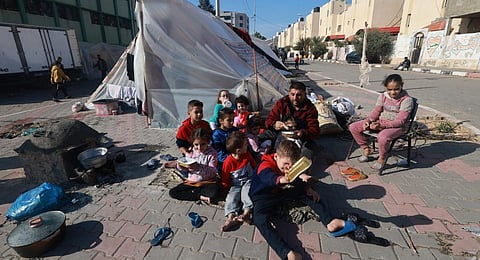 A displaced Palestinian family who fled Khan Younis sets up camp in Rafah further south near the Gaza Strip's border with Egypt, on December 6, 2023. (Photo | AFP)