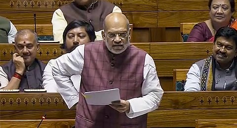 Union Home Minister Amit Shah speaks in the Lok Sabha during the Winter session of Parliament, in New Delhi, Wednesday, Dec. 6, 2023. (PTI Photo)