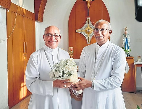 Archbishop Mar Andrews Thazhath (R) welcomes Bishop Bosco Puthur, who took charge as the new Apostolic Administrator of the Ernakulam-Angamaly Archdiocese.