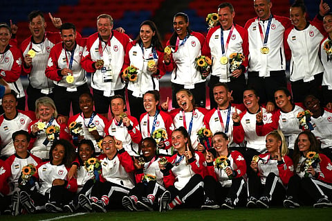 In this file photo taken on August 6, 2021, Canada's women's football team and staff members pose with their Gold Medals during the victory ceremony after the Tokyo 2020 Olympic Games. (Photo | AFP)
