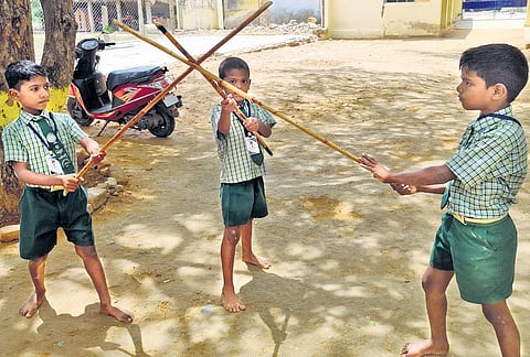 Kids at the primary school with Silambam sticks as part of their school curriculum in  Virudhunagar | Express