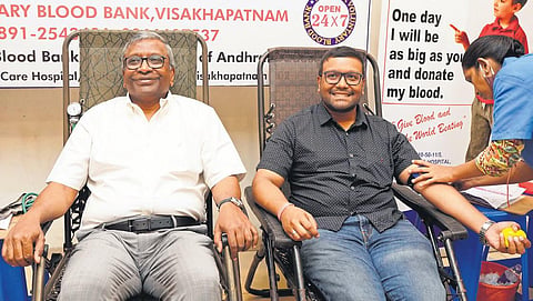 KRB Prakash and his son K Rohit donating blood at a camp in Vizag | EXPRESS