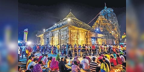 Devotees light diyas on the premises of Lingaraj temple on the occasion of Maha Shivaratri, in Bhubaneswar on Saturday (Photo| Debadatta Mallick)