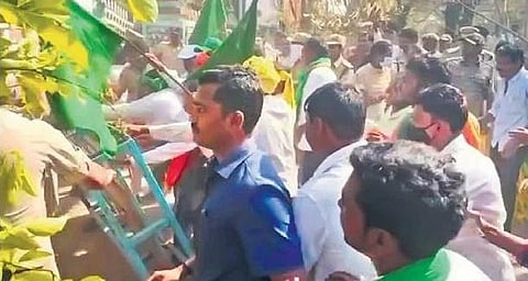 Tribals stage a protest outside the Utnoor ITDA office on Monday