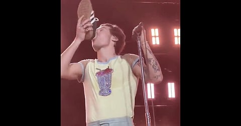 Harry Styles does the 'shoey' at a concert in Perth. (Photo | Screengrab @Twitter)