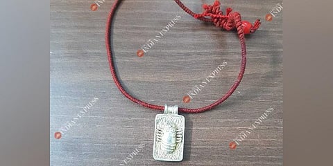 Victim's pendant.