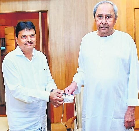 Finance Minister Niranjan Pujari presenting a digital copy of budget to  CM Naveen Patnaik at the Assembly in Bhubaneswar | EXPRESS