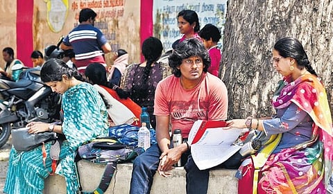 Candidates during their last-minute preparation for the TNPSC Group II exam at a centre in Presidency Girls High School in Chennai on Saturday 