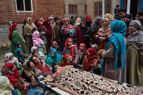 Family members mourn after Sanjay Sharma, a Kashmiri Pandit, was shot dead by terrorists at Achan area in Pulwama. (Photo | PTI)