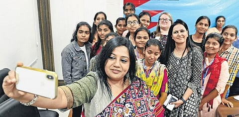 Janaka Pushpanathan, director of south India region, British Council, takes a selfie with the selected candidates;  Vinay Madapu