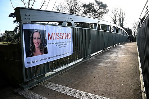 A banner asking for information on missing Nicola Bulley is pictured on a bridge in St Michael's on Wyre, north west England on Feb 6, 2023, as the search for her continues. (Photo | AFP)