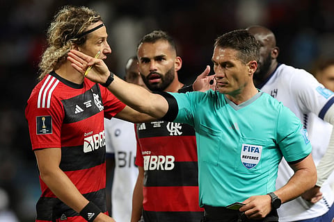 Defender David Luiz (L) argues with Romanian referee Istvan Kovacs during the FIFA Club World Cup semi-final match between Brazil's Flamengo and Saudi Arabia's Al-Hilal, Feb. 7, 2023. (Photo | AFP)