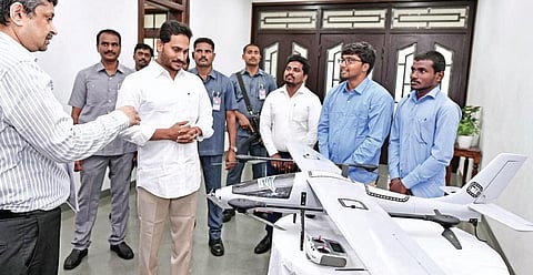 Chief Minister Jagan Mohan Reddy looks at drones and other equipment meant for the land resurvey at a review meeting in Tadepalli on Monday I Express