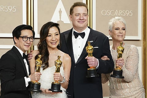 Ke Huy Quan, from left, Michelle Yeoh, Brendan Fraser and Jamie Lee Curtis pose with their awards in the press room at the Oscars on Sunday, March 12, 2023, at the Dolby Theatre in Los Angeles. Brendan Fraser, third from left, won best performance by an a