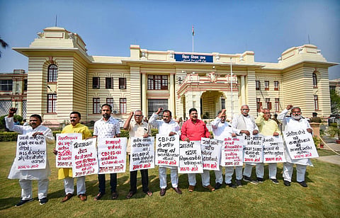 Communist Party of India (ML) legislators stage a protest outside Bihar Assembly during the Budget Session, in Patna, March 13, 2023. (Photo | PTI)