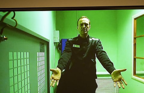 Russian opposition leader Alexei Navalny is seen on a TV screen. (File Photo | AP)