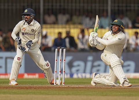 Usman Khawaja braving the storm...