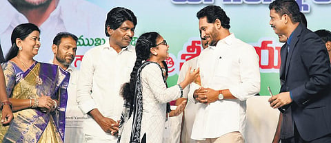 CM YS Jagan Mohan Reddy interacting with a student during Jagananna Vidya Deevena scheme funds distribution programme in Tiruvur on Sunday | Express