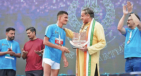 MP Shashi Tharoor congratulating the winner of GTech marathon held in Thiruvananthapuram on Sunday